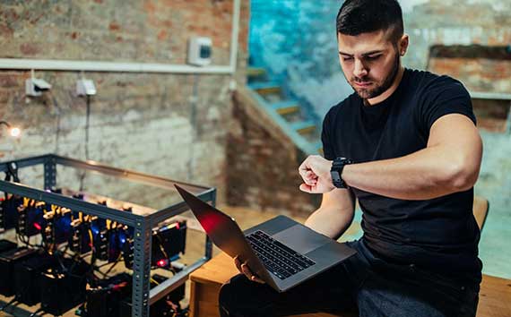 Bitcoin Miner At Work on Laptop