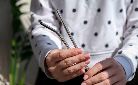 Woman Holds Straws