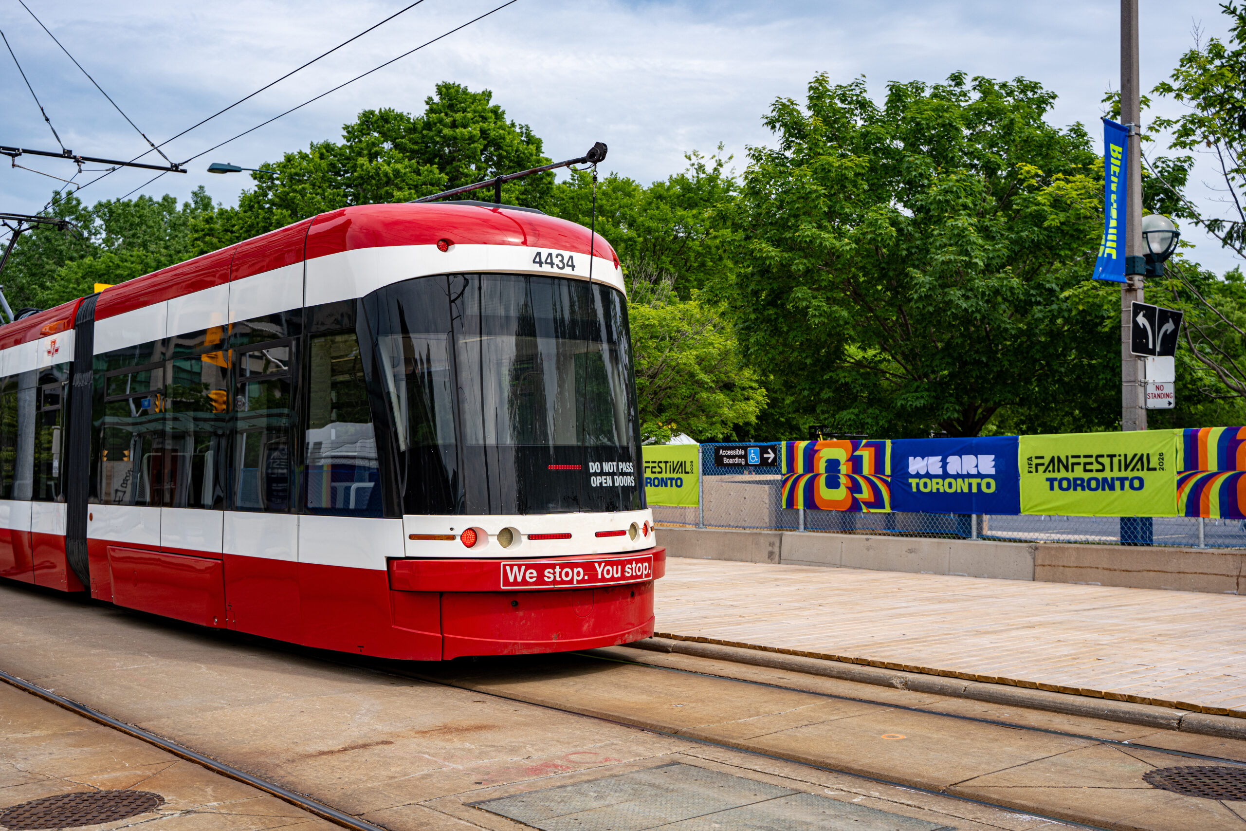 2026 FIFA World Cup Carbon Footprint: A Sustainability Guide 1 Toronto streetcar passing FIFA Fan Festival 2026 venue area. Toronto, Canada - June 9, 2026.